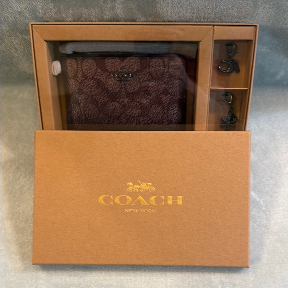 Coach Corner Zip Wristlet with charms